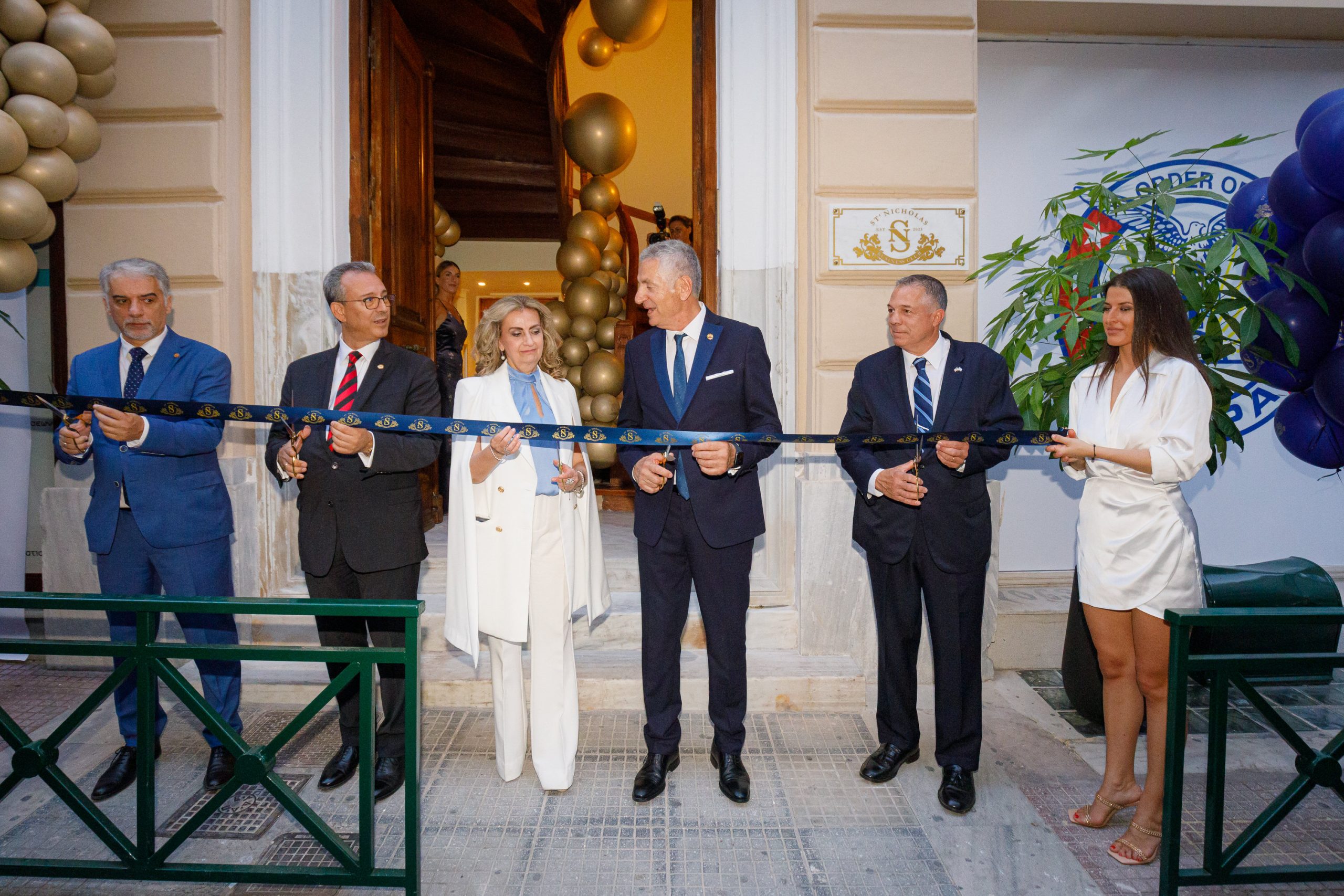 st-nicholas-business-club-president-cutting-the-ribbon-at-inauguration-party